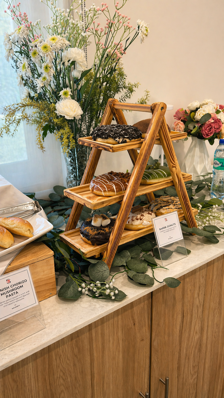 Wide view of an AIRE corporate buffet set against client-site quality and EOSHE policy posters